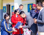 Distributing study materials to the students.